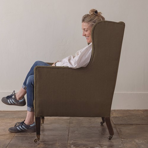 A Dark Green Victorian Wingback Armchair