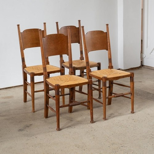 Set Of Four Oak And Rush Chairs By William Birch C1900