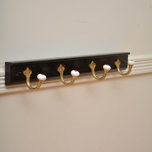 Brass And Ceramic Coat Hooks On Oak Backing Coat Rack