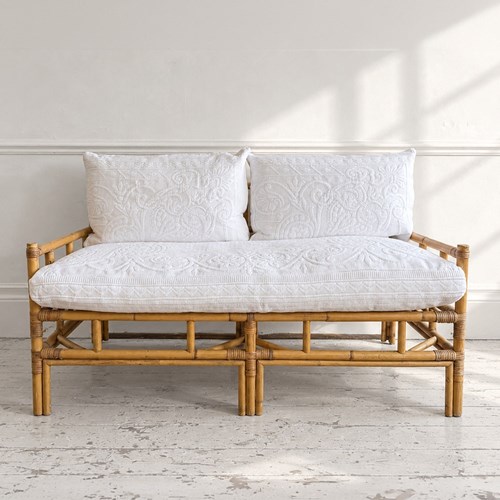 A 1970'S French Bamboo Sofa With Antique Piqué Upholstery