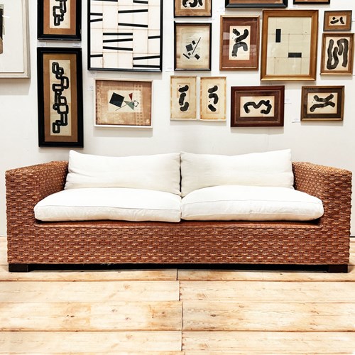 A 1970'S French Raffia Rattan Three Seater Sofa