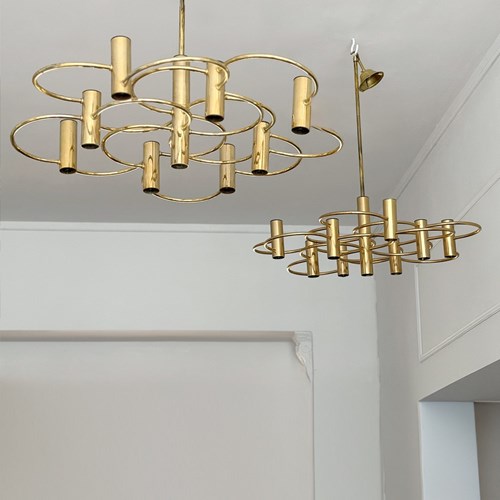 A Pair Of 1970'S Italian Brass Plated Circle Chandeliers