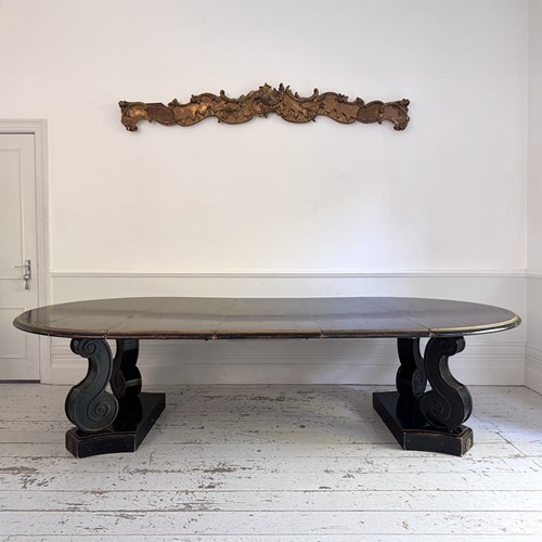 A 1920'S Regency Style Ebonised Extending Dining Table