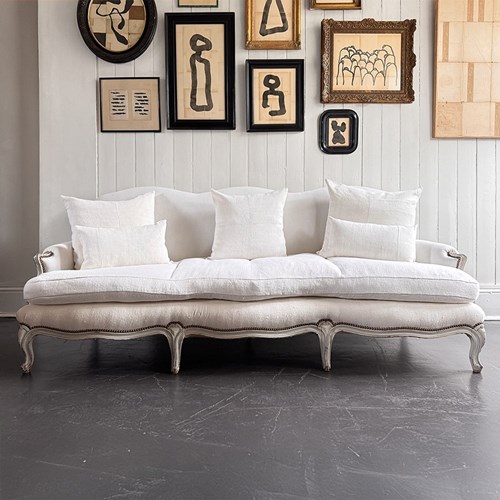A 19Th C French Camel Back Sofa With Serpentine Front