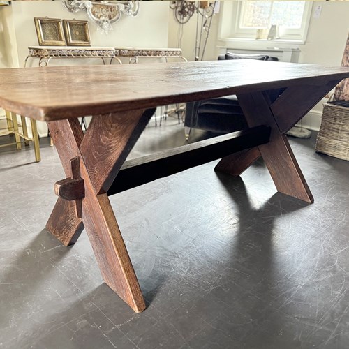 A Late 19Th Century French Pine Sawbuck Trestle Table