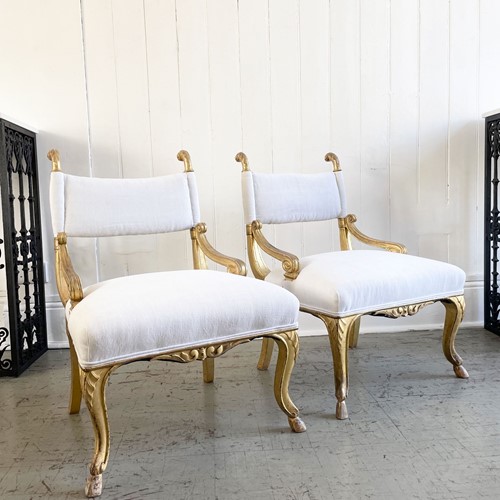 A Pair Of Petite Regency Gilt Wood Armchairs