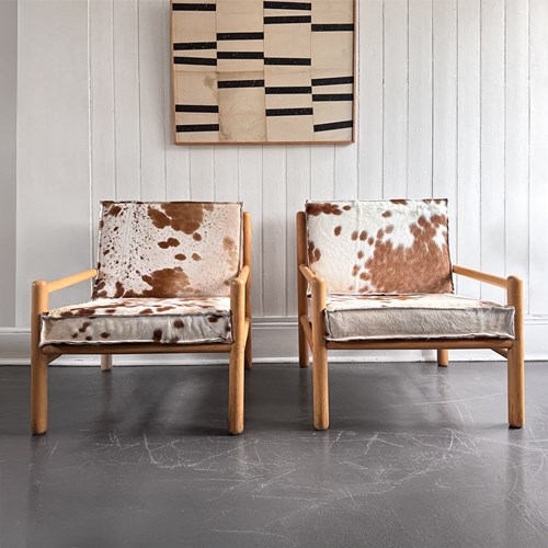 A Pair Of 1970'S Italian Lounge Armchairs With Cowhide Upholstery