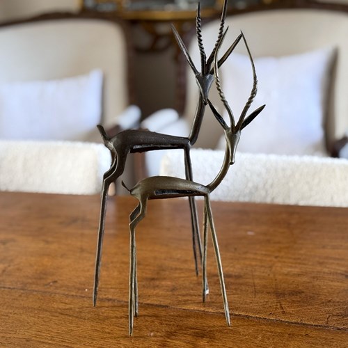 A Pair Of 1950'S Congolese Brass Gazelle Sculptures