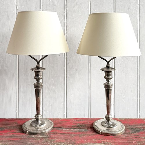 A Pair Of Silver Plated Regence Candlestick Table Lamps