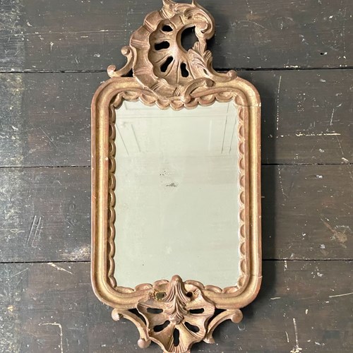 A Small French Late 18Th C Carved Giltwood Mirror