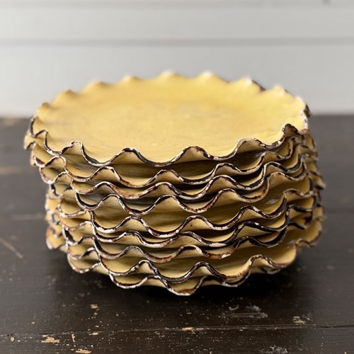 A Set Of Nine 1950'S Dieulefit Scalloped Ceramic Plates