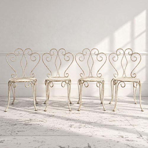 A Set Of Four Early 20Th C French Painted Wrought Iron Garden Chairs