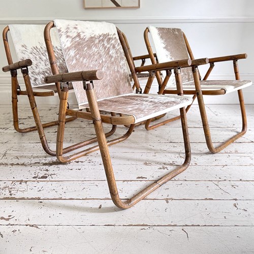 Two Pairs Of 1970'S Folding Bamboo Cowhide Armchairs