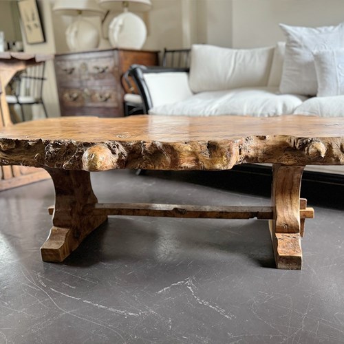 A 1970'S Live Edge Burr Elm Coffee Table On Trestle Base