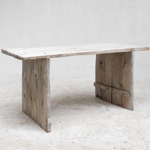 Bleached-out hewn slab table