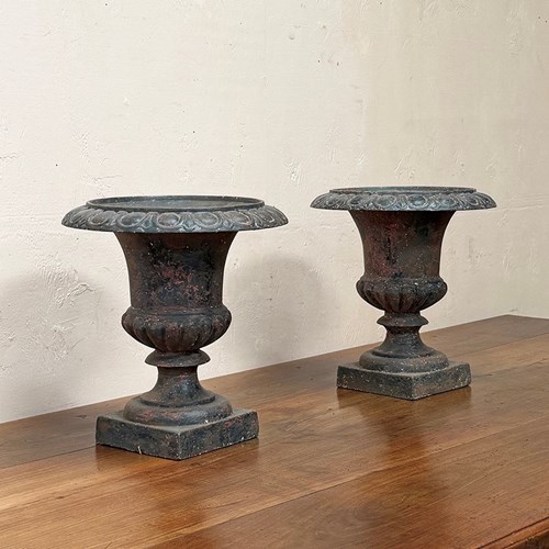 Pair Of Iron Urns