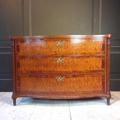 A 19Th Century Serpentine Satinwood Commode