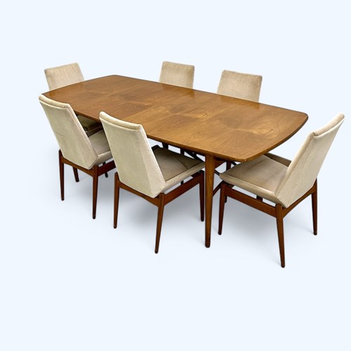 An Extending Hamilton Rosewood Dining Table & Ten Chairs By Robert Heritage