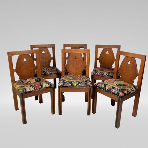 A Set Of Six Oak Art Deco And Kilim Dining Chairs