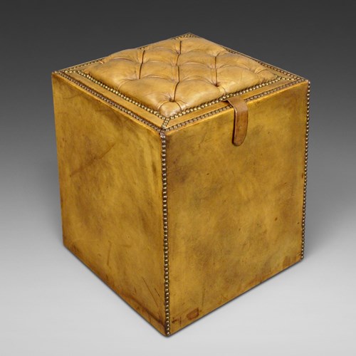 A Buttoned Leather Upholstered Ottoman