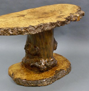 A naturalistic burl elm coffee table