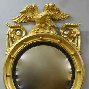 A Regency carved & gilt convex mirror