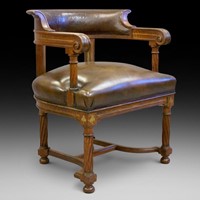 A rare bold 19th century brass inlaid arm chair