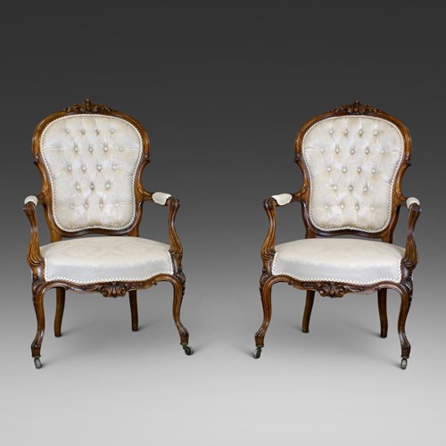 A Fine Pair Of Victorian Rosewood Arm Chairs