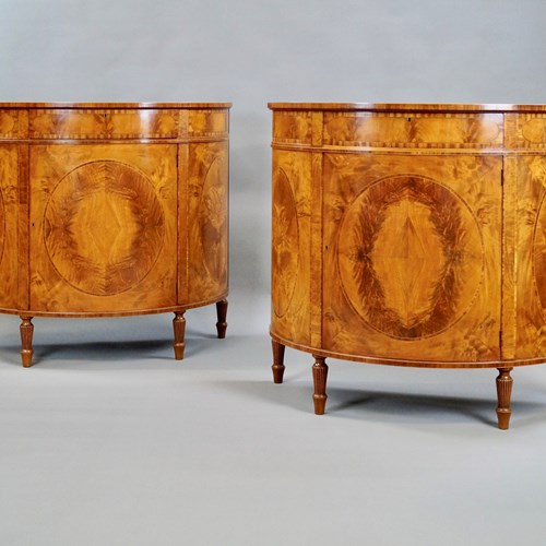 A Fine Pair Of Satinwood Demi Lune Commodes