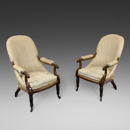 A Pair Of Victorian Rosewood Arm Chairs