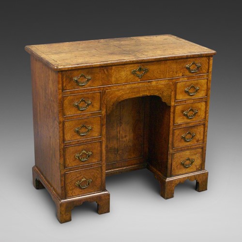 George II figured walnut knee-hole desk