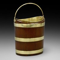 A Dutch mahogany and brass bucket