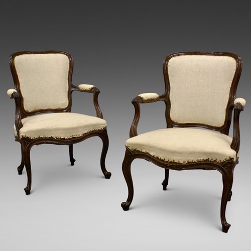 A pair of French Hepplewhite arm chairs