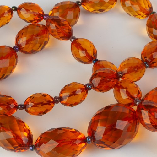 A Necklace Of Cut Amber Beads 