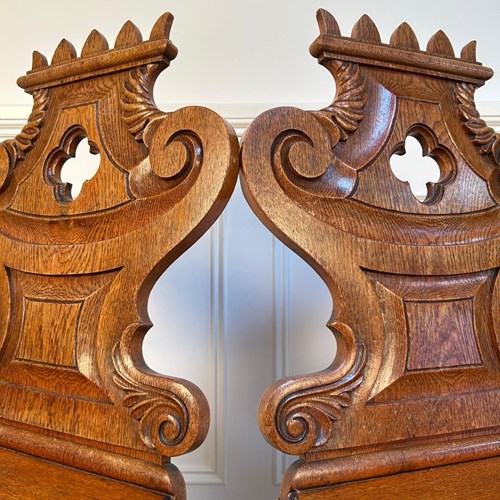 A Bold Pair Of Gillows Oak Hall Chairs