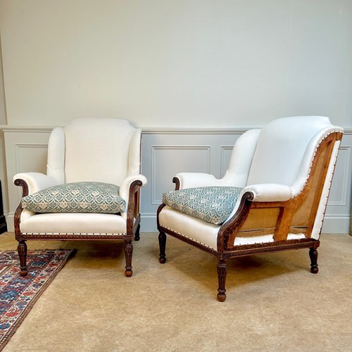 A Pair Of Edwardian Howard & Sons Armchairs