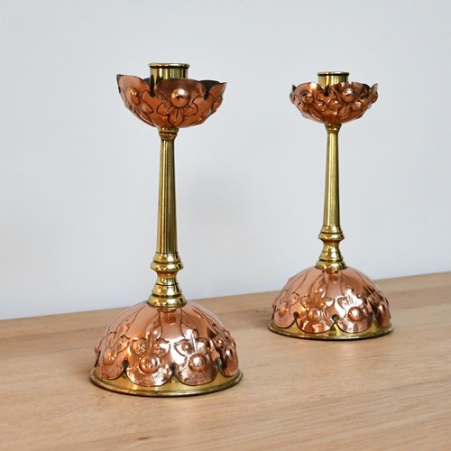 A Pair Of Arts & Crafts Candlesticks